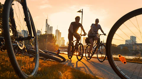 Getty Images Many people bike or walk to work (Credit: Getty Images)