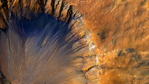 Nasa/JPL-Caltech/University of Arizona Many craters are streaked with rivulets thought to be made of salty water (Credit: NASA/JPL-Caltech/University of Arizona )