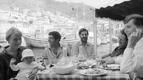James Burke/The LIFE Picture Collection/Getty Images Cohen met his muse Marianne Jensen on the Greek island of Hydra; she is pictured next to him, left, with her son Axel Jensen Jr in October 1960 (Credit: Getty Images)