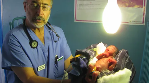 Kenneth Iserson In Zambia, Iserson pioneered the use of light bulbs as incubators for premature babies (Credit: Kenneth Iserson)