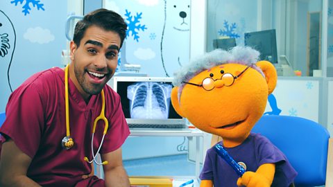 A still from Get Well Soon showing Dr Ranj and a patient.