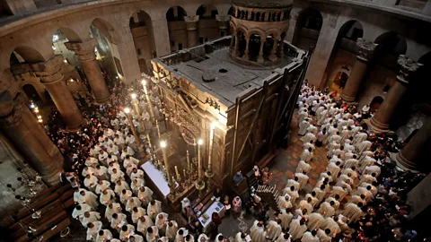 Gali Tibbon/AFP/Getty Images Roman Catholic clergymen circle the Edicule, which is believed to contain the tomb of Jesus (Credit: Gali Tibbon/AFP/Getty Images)