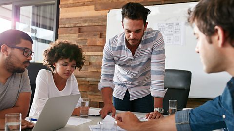 A film producer meeting with the production team