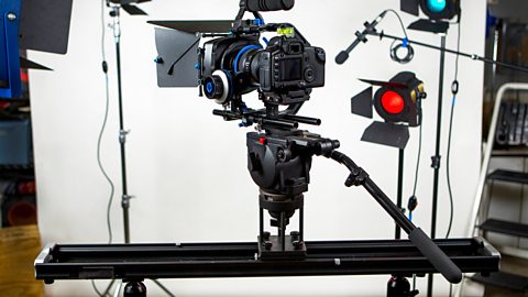 A slider set up on top of a tripod.