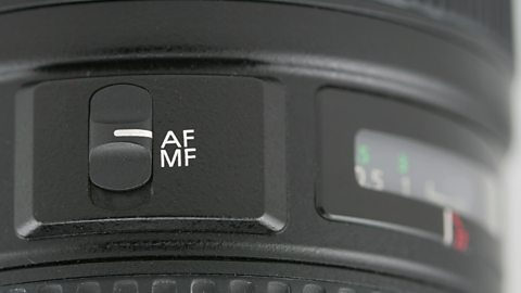 The autofocus switch on a DSLR lens