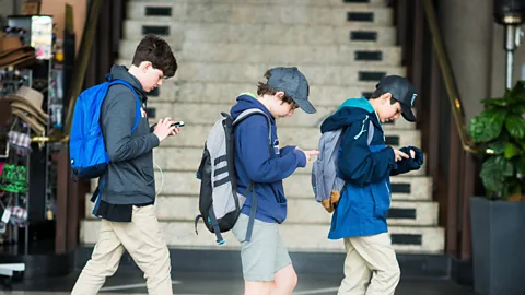 Getty Images "Smombie" - short for "smartphone zombie" - was Youth Word of the Year in Germany in 2015 but took on new urgency with the Pokemon Go craze this summer (Credit: Getty Images)