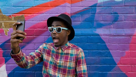 Getty Images Some argue that we are always aware of our audience online and never reveal our real selves - we put on different performances depending on who we talk to (Credit: Getty Images)