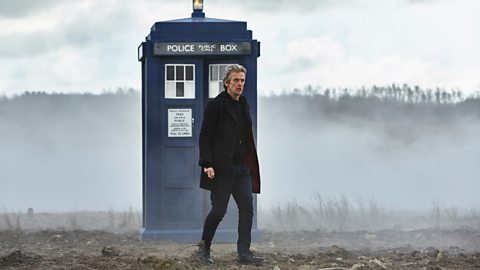 Peter Capaldi as Dortor Who with the TARDIS in the background