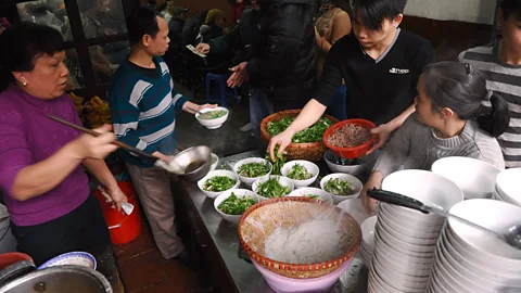 Hoang Dinh Nam/AFP/Getty Images Pho is prepared differently in northern and southern Vietnam (Credit: Hoang Dinh Nam/AFP/Getty Images)