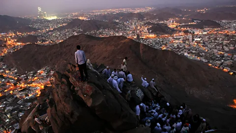 Getty Images A sense of location is also critical to many religious practices - meaning that those beliefs could be bound to life on our planet (Credit: Getty Images)