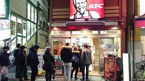 KFC Japan Demand is so high for KFC at Christmastime that people can queue outside for meals (Credit: KFC Japan)