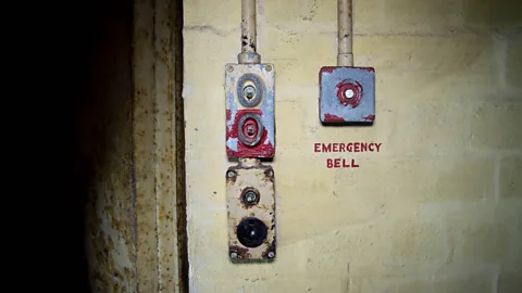 William Park An emergency bell inside Drakelow's ‘safe room’, which has no windows and a heavy steel door (Credit: William Park)
