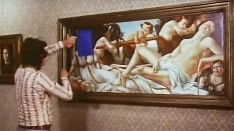 YouTube John Berger cut into a copy of a Botticelli painting in the first episode of his 1972 series Ways of Seeing, shocking viewers (Credit: YouTube)