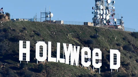 Gene Blevins/AFP/Getty Images Pranksters changed the Hollywood sign on 1 January, marking a new law making recreational use of marijuana legal (Credit: Gene Blevins/AFP/Getty Images)
