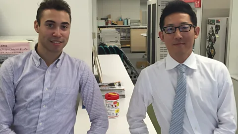 Stuart Nomimizu It got to the point where Stuart Nomimizu (left) was working so many 80-hour work weeks in Tokyo that he fainted (Credit: Stuart Nomimizu)