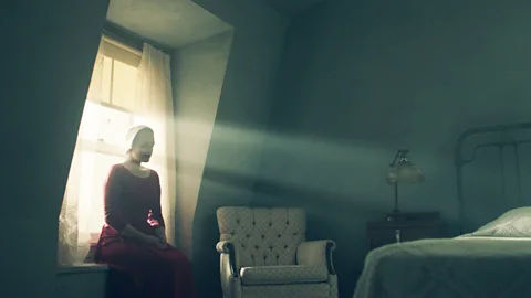 Hulu Margaret Atwood’s dystopian novel, The Handmaid’s Tale, is about a future America that’s become a rigid theocracy (Credit: Hulu)