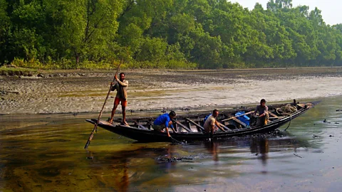STRDEL/Getty Fishermen who stray into the forest face the risk of being attacked by tigers (Credit: STRDEL/Getty)