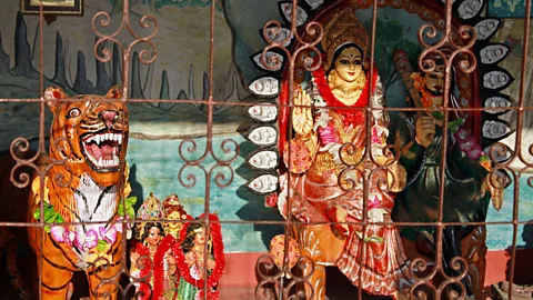 Jack Palfrey Despite multiple attacks, locals still worship the felines and maintain a shrine in their honour (Credit: Jack Palfrey)