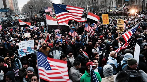 Getty Images Demonstrators protest President Donald Trump's executive order on immigration in Brooklyn, New York (Credit: Getty Images)