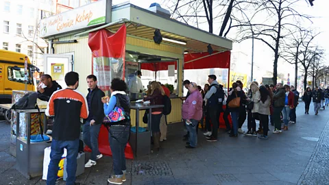 Schöning/ullstein bild/Getty The modest street snack has turned into a major staple of the German diet (Credit: Schöning/ullstein bild/Getty)