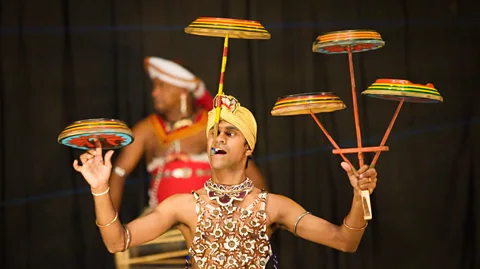 Alamy Unlike spinning plates for real, people who multi-task usually don't get better with practice (Credit: Alamy)