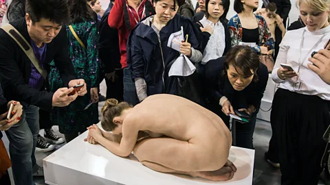 Getty Images Crowds admire a work by Australian artist Sam Jinks at Art Basel Hong Kong in 2015 (Credit: Getty Images)