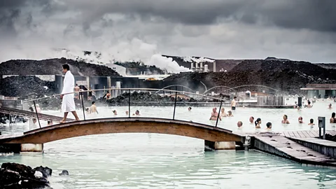 Getty Images The Blue Lagoon has long been one if Iceland's most popular attractions. The artificial pool is warmed by a nearby geothermal power plant (Credit: Getty Images)