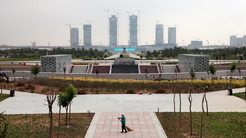 Getty Images In China's ghost cities, apartment blocks, shopping complexes, plazas and parkland lie empty (Credit: Getty Images)