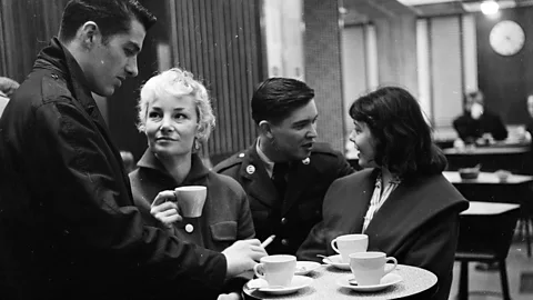 Getty Images Young people chat in a London coffee shop in 1957 (Credit: Getty Images)