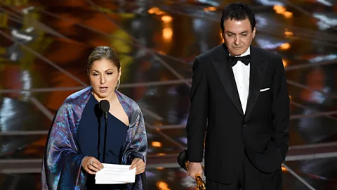Getty Images Astronaut Anousheh Ansari (left) accepted the award for best foreign language film for The Salesman on behalf of Asghar Farhadi, who stayed home in protest (Credit: Getty Images)
