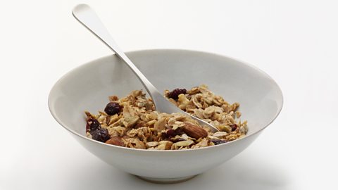 A bowl of cranberry granola cereal