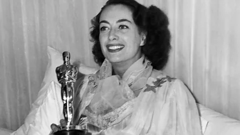 Alamy Crawford won an Oscar for Mildred Pierce but feigned illness and was hospitalised because she thought she would lose. She allowed cameras to her bed after winning (Credit: Alamy)