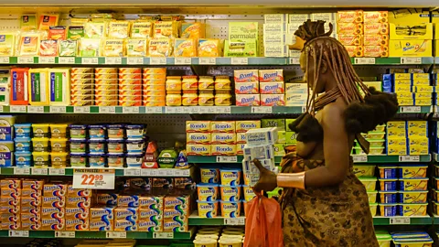 Alamy A Himba woman goes grocery shopping in Opuwo. Exposure to this busy visual environment may permanently change her perception (Credit: Alamy)