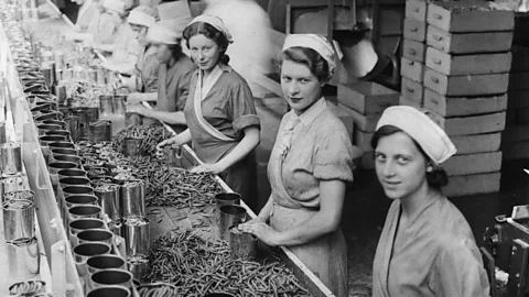 Getty Images In 1934, women on a production line canning beans in Cambridgeshire, UK - a job that no longer exists (Credit: Getty Images)