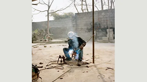 Xiaoxiao Xu After a thief stole his airframe and engine to sell as scrap iron, Cao Zhengshu has a bed in his shed and sleeps there every night to watch over his aircraft. (Credit: Xiaoxiao Xu)
