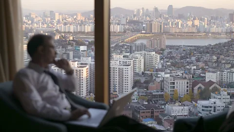 Getty Images Expats leaving the office before the rest of their colleagues are likely to raise some eyebrows (Credit: Getty Images)