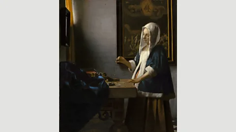 National Gallery of Washington Vermeer’s Woman with a Balance riffs on and improves elements of de Hooch’s Woman Weighing Gold Coin (Credit: National Gallery of Washington)