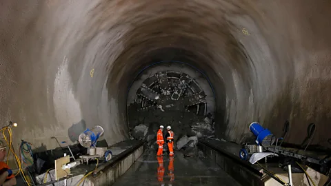 Alamy Engineers stand before a tunnel boring machine just after it broke through at Whitechapel underground station in 2014 (Credit: Alamy)