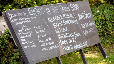 Plunkett Foundation A sign at the Seven Stars promotes not only an ale and cider festival, but the quirky, traditional pub game Aunt Sally (Credit: Plunkett Foundation)