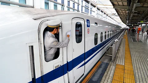 Trevor Mogg/Alamy Japanese train conductors practice shisa kanko, pointing at what they need to check and then naming it out loud (Credit: Trevor Mogg/Alamy)