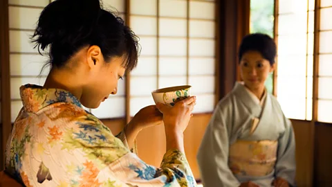 Lonely Planet/Getty In tea ceremony, participants take time to notice the design of the cup (Credit: Lonely Planet/Getty)