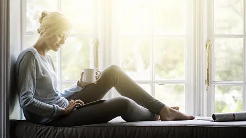 Getty Images Putting on a different face at the office can take its toll for people who prefer the quiet home life (Credit: Getty Images)