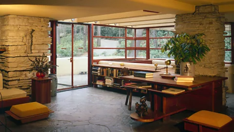 Alamy Much of the furniture in Fallingwater, such as this living room, was built into the structure so its interior design would remain fixed (Credit: Alamy)