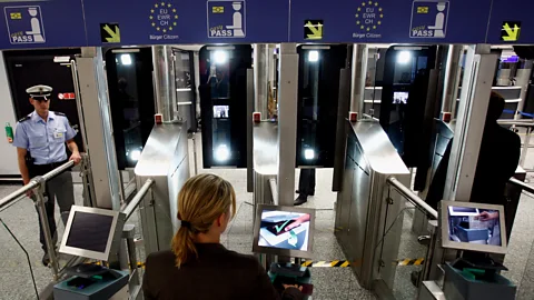 Getty Images For the past several years, humans have worked more closely with self-service machines that assume certain employee duties, like passport scanning. (Credit: Getty Images)