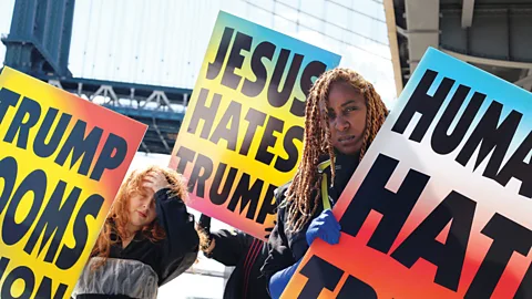 Matthew Raviotta and Burke Battelle for Badlands Unlimited Artist Paul Chan has designed these protest signs modelled on those of the Westboro Baptist Church (Credit: Matthew Raviotta and Burke Battelle for Badlands Unlimited)