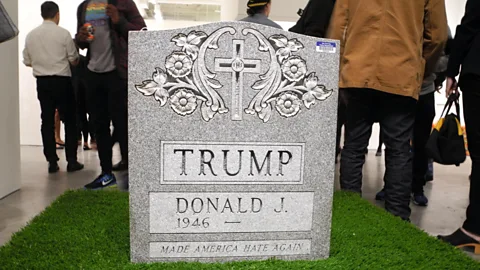 Alamy Brian Whiteley designed this tombstone for display in Central Park – much like the naked statue of Trump that also appeared in New York City (Credit: Alamy)