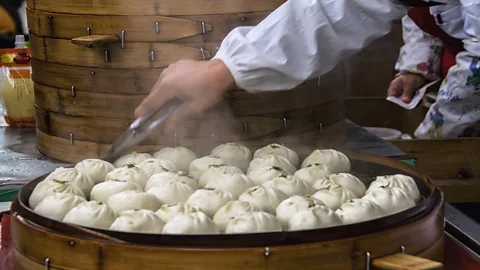 Diane Levit Design Pics/Getty Images Eat like a local using dianping.com to find noodle shops and dumpling houses (Credit: Diane Levit Design Pics/Getty Images)