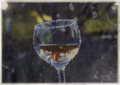 Hand-coloured photograph of a wine glass with stitched contour lines