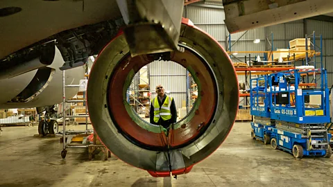 Richard Gray One of the team looks through an engine mount that has had the working parts of the engine removed (Credit: Richard Gray)