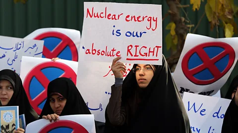 Getty Images Not all nuclear rallies are anti. In Tehran, this student holds a sign backing Iran's nuclear programme (Credit: Getty Images)